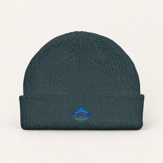 the classic mt hood fisherman beanie on a warm neutral studio background