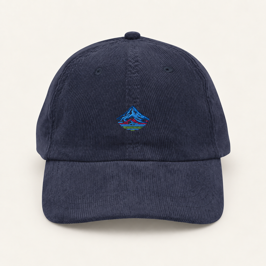 the mt hood corduroy cap on a warm neutral studio background